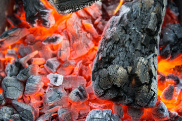 Smoldering charcoal in a barbecue close-up
