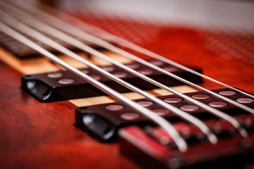 Fototapeta premium Brown Electric Bass Guitar. Close Up. Abstract Picture