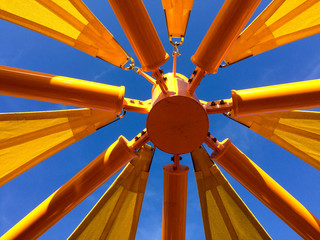 Modern art geometric shapes background yellow red on blue sky sunny day