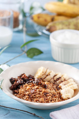 Healthy and delicious breakfast, granola with bananas and yogurt
