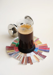 Brewing black coffee in French press. On coffee Taster's Flavor Wheel. White background