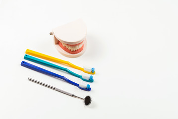 Jaw layout and pocket mirror isolated on white.