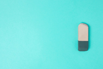 used eraser on a blue background with copyspace