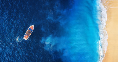 Seascape with beach and boat. Yachts at the sea surface. Aerial view of luxury floating boat on blue Adriatic sea at sunny day. Travel - image