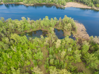 Fototapeta na wymiar Dnieper riverbank in Kiev on a sunny spring day. Aerial drone view.