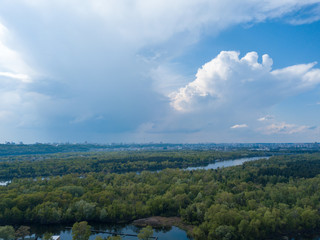 Rain clouds over the Dnieper River in Kiev. Aerial drone view.