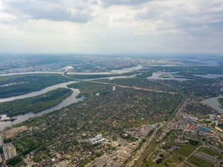 Spring rain over Kiev. There are black thunderclouds in the sky, dark rain falls on the city. Aerial drone view.