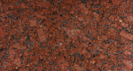 Panoramic red granite surface. Texture background for graphic applications