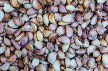 Abstract full flame garlic pile and onion pile for background.