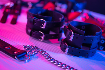 Set of erotic toys for BDSM. The game of sexual slavery with a whip, gag and leather blindfold....