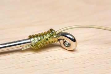 Snell Knot in nylon trace line, hook snelled to provide a straight line pull without use of the...