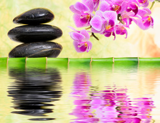 Obraz na płótnie Canvas Japanese Zen garden with stacked stones mirroring in water