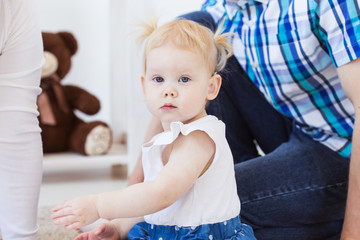 Fototapeta premium Baby girl wearing a hearing aid. Disabled child, disability and deafness concept.