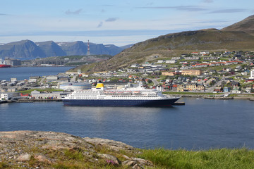 Fototapeta na wymiar Cruise ship docked in the port of Hammerfest, which is the northernmost town in the world with more than 10,000 inhabitants, Troms og Finnmark county, Norway.