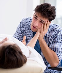Man mourning his dead wife