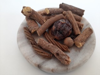 Neem leaves in Mortar Grinder drug and ingredient herbs on plain white background
