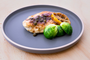 Italian food Lemon chicken Piccata  with Brussels Sprouts