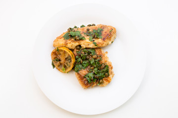 Italian food Lemon chicken Piccata with parsley