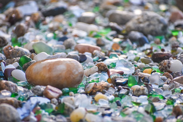 Shells, stones and crystals rounded by the erosion of the sea Los Cristales Beach, Galicia. Spain.