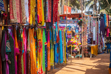 Fototapeta na wymiar Indian bazaar benches with colorful saris