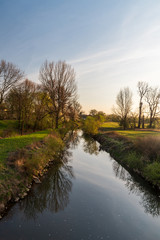 Fototapeta na wymiar Odra river with meadow and trees around near Ostrava city in Czech republic