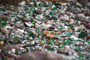 Shells, stones and crystals rounded by the erosion of the sea Los Cristales Beach, Galicia. Spain.