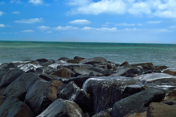 Rocks on the beach and clear horizon.