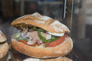 Tuna nicoise sandwich, also known as pan bagnat. The pan bagnat is a sandwich that is a specialty