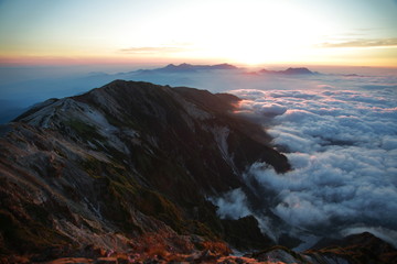 Fototapeta na wymiar Clouds and mountain in the early morning in Shirouma dake, Nagano