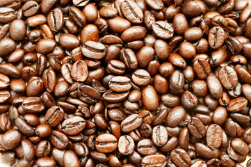 Coffee beans Coffee scattered on the table, roasted top view, natural sunlight falling on coffee, close up, background.