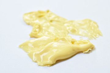cheese melting down by heat temperature on white background