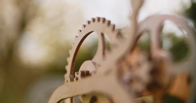 Wooden mechanism with several gears. Symbol of unstoppable nature processes. Evolution never stops. Environment is essential part of our life. Quarantine helps us to fill up with new knowledge