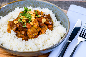 A traditional Moroccan dish called Chicken Tajine featuring Saffron, Honey, Almonds, Dates and Plain White Rice