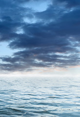 Night seascape. Dark landscape with a marine background and sunset, moon. Abstract night landscape in blue light. Reflection of the moon in the night water. Empty futuristic landscape.