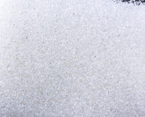 Close up of crystal sugar in Glass bottles on white background.