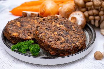 Tasty vegetarian food, burgers with champignons mushrooms, buna shimeji, carrot and onion