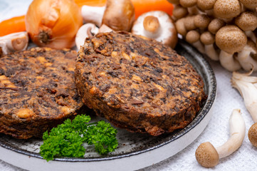 Tasty vegetarian food, burgers with champignons mushrooms, buna shimeji, carrot and onion