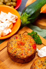 Tasty vegetarian food, burgers with Greek feta cheese, sweet red paprika, green olives and zucchini