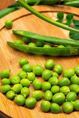 New harvest of ripe green peas legumes