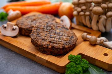 Tasty vegetarian food, burgers with champignons mushrooms, buna shimeji, carrot and onion