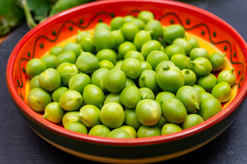 New harvest of ripe green peas legumes