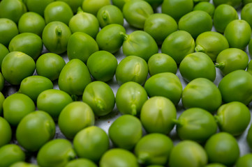 New harvest of ripe green peas legumes