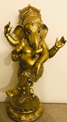 golden statue of a lord Ganesha a deity 