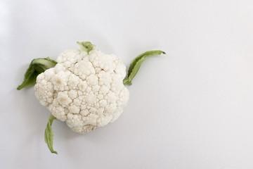The cauliflower in one specimen is on the left in the photo, isolate on a white background