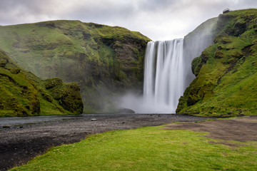 The beautiful Skogarfoss waterfall in Iceland early morning without people. Travelling and Icelandic concept.