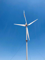 Fototapeta premium Windmill over blue sky background