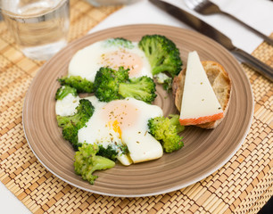 breakfast of crumpled eggs with broccoli