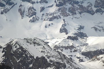 Fototapeta na wymiar Closeup of a glacier, snow and rocks of San José vulcano viewed from Lo Valdés Valley, Cajón del Maipo, Central Andes of Chile.