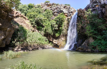 Mountain  Saar Falls with cold and crystal clear water descends from a crevice in the mountains of...