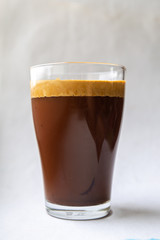 Glass Cup with coffee on a white background